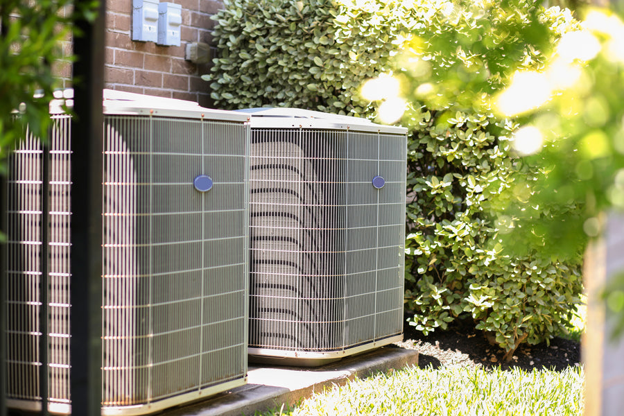 Central air conditioning condenser unit outside a home, the type of residential system Micro-Air EasyStart and EasySurge Guardian protect